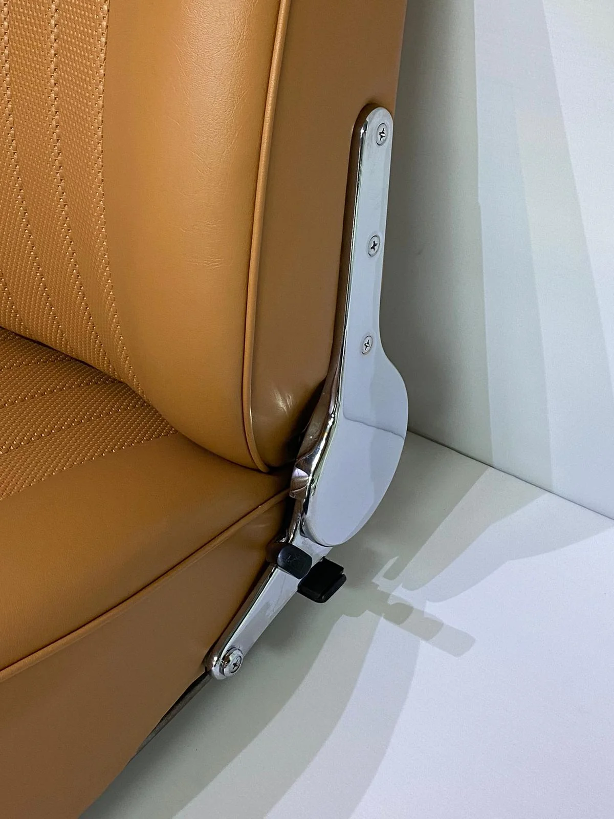 Chrome Porsche 911 seat adjustment mechanism with leather trim