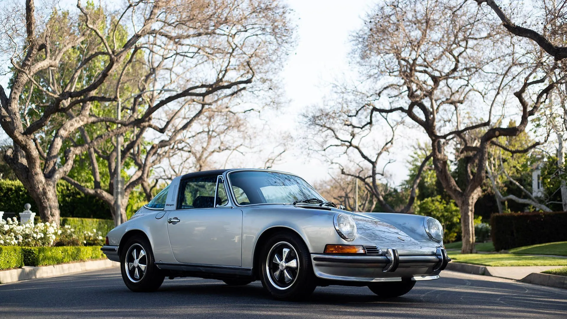 Silver Porsche 911 Targa with restored roof, three-quarter front view