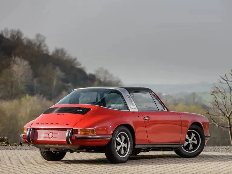 Red Porsche 911 Targa with restored roof, three-quarter rear view