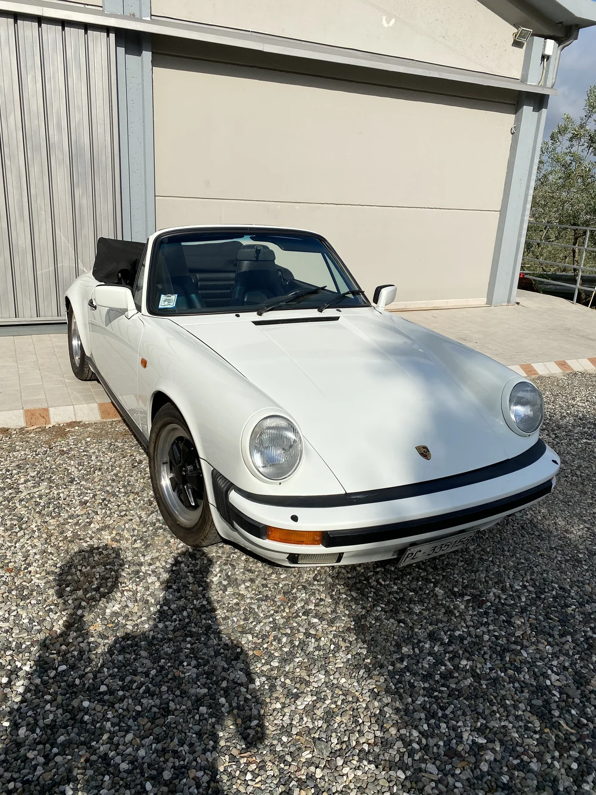 White Porsche 911 SC Cabriolet, front detail with headlights and bumper